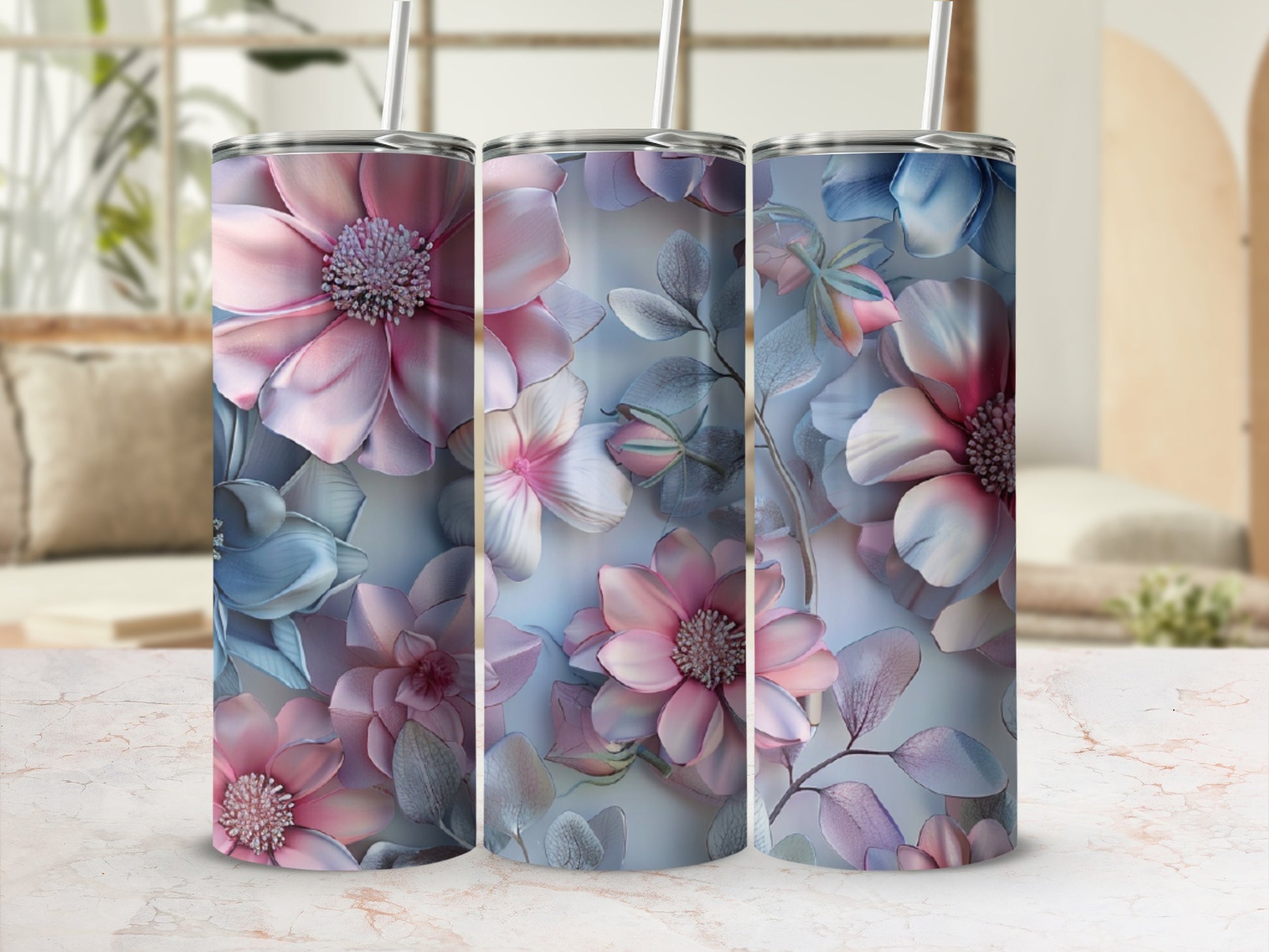 Three tumblers with pink and blue floral patterns.