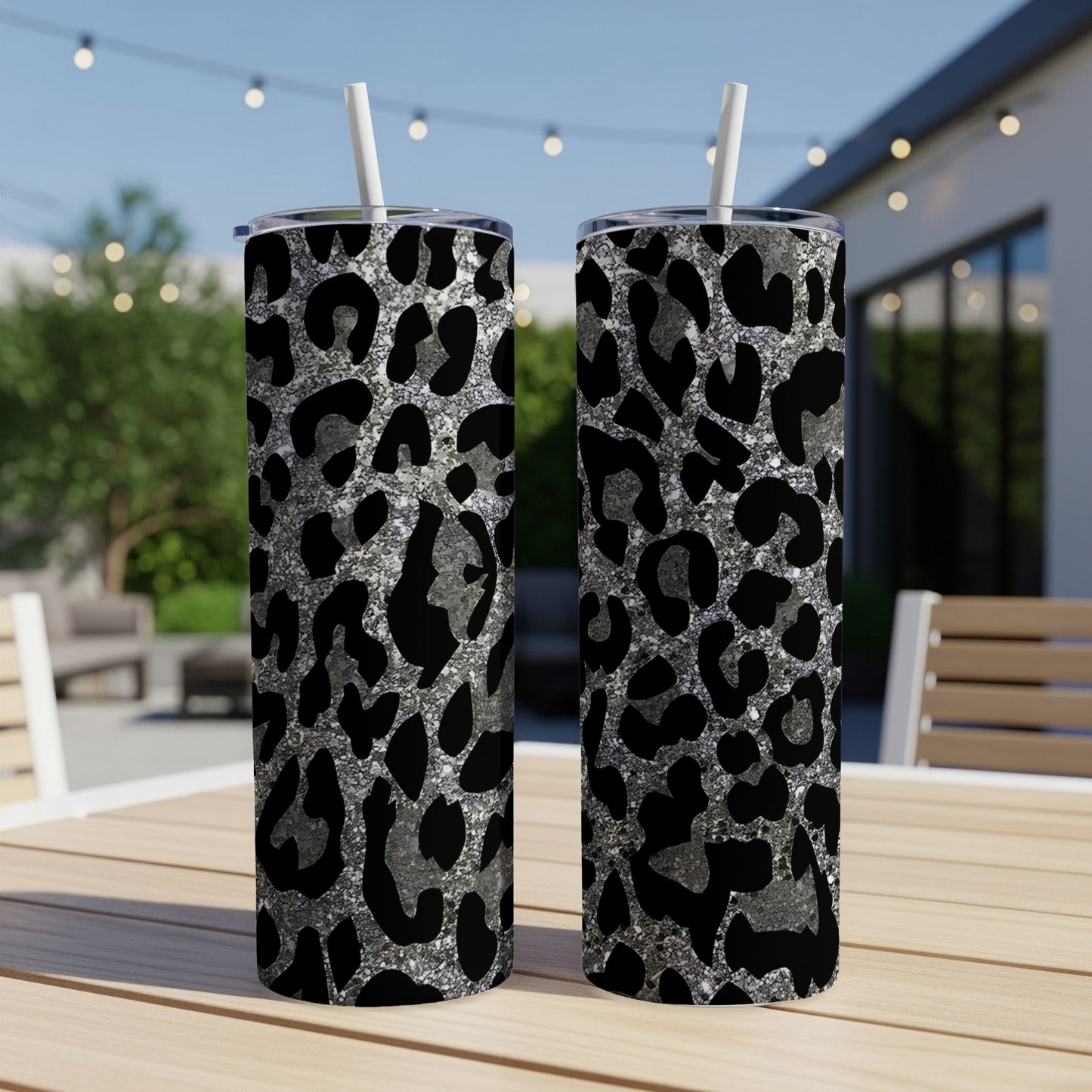 Two tall tumblers with a silver and black leopard print design.