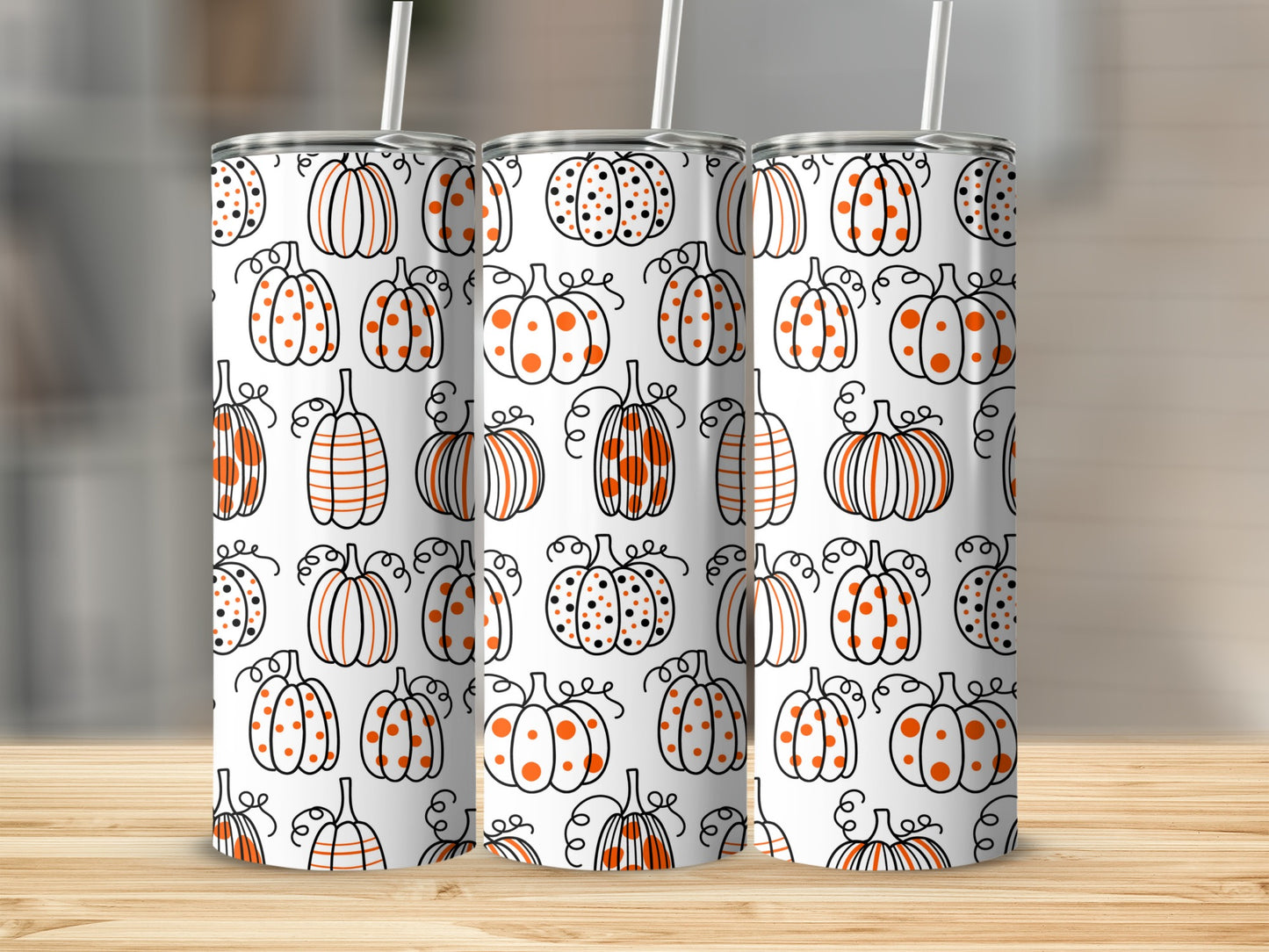 Seamless pattern of hand-drawn pumpkins with stripes and polka dots on white background.
