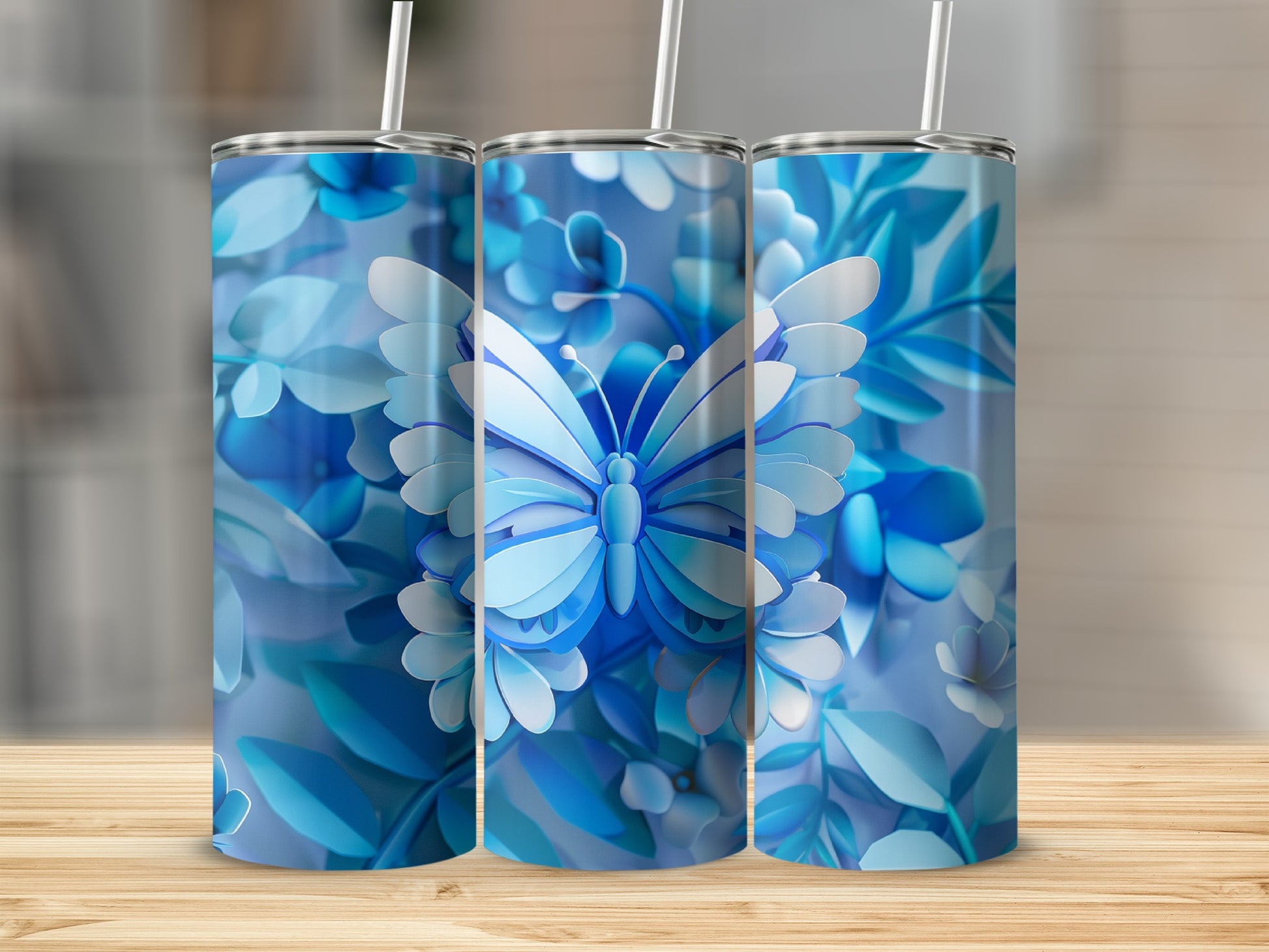 Three tumblers with blue butterfly and floral pattern.