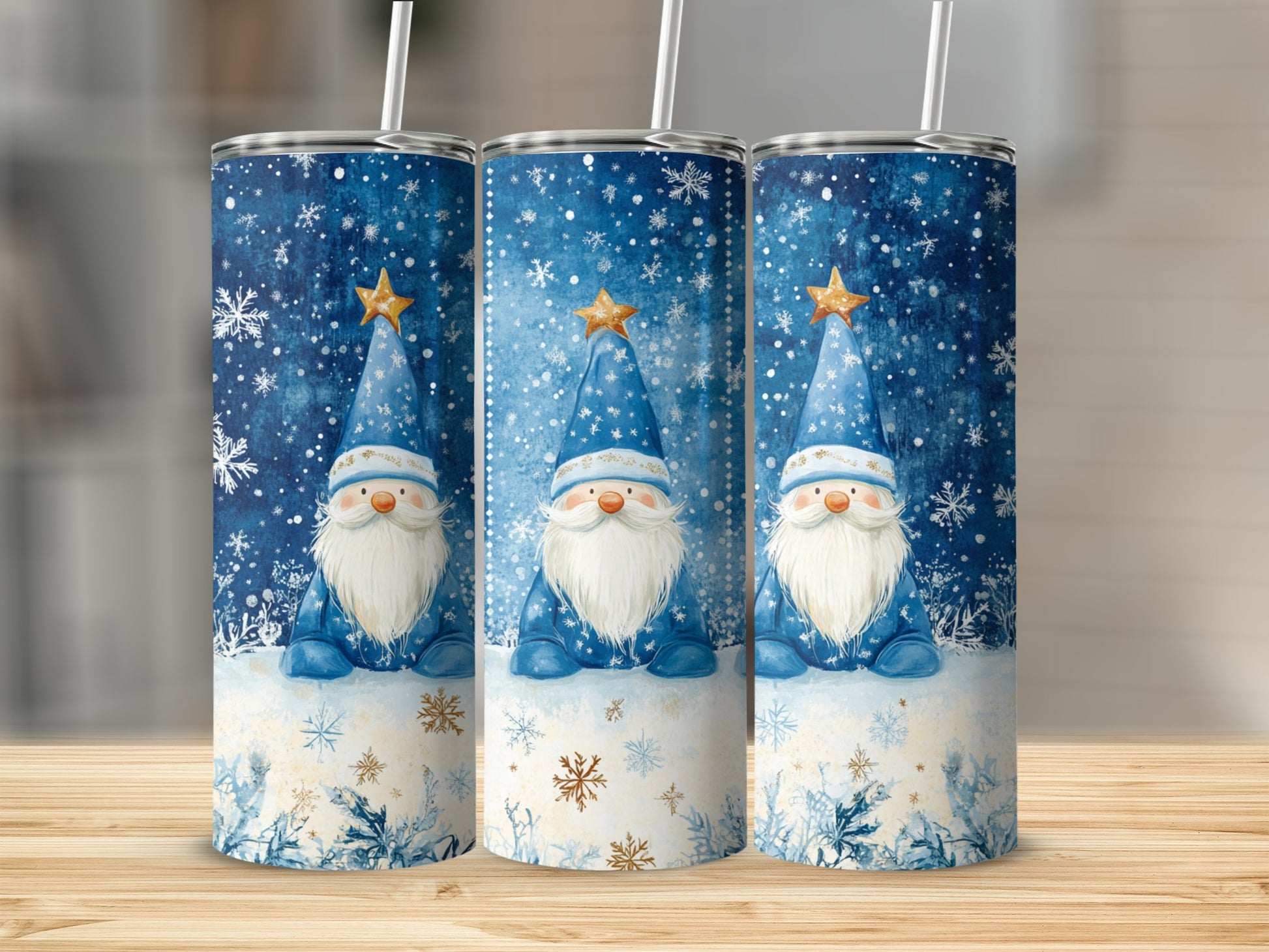Three blue tumblers with snowmen and snowflakes, each with a straw.