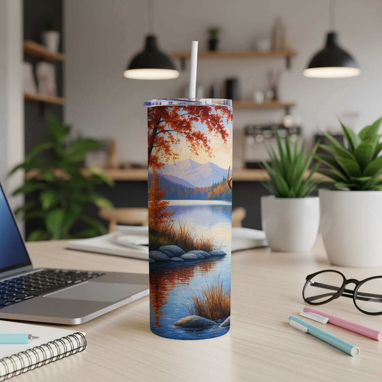 Fall landscape tumbler with deer by a lake.