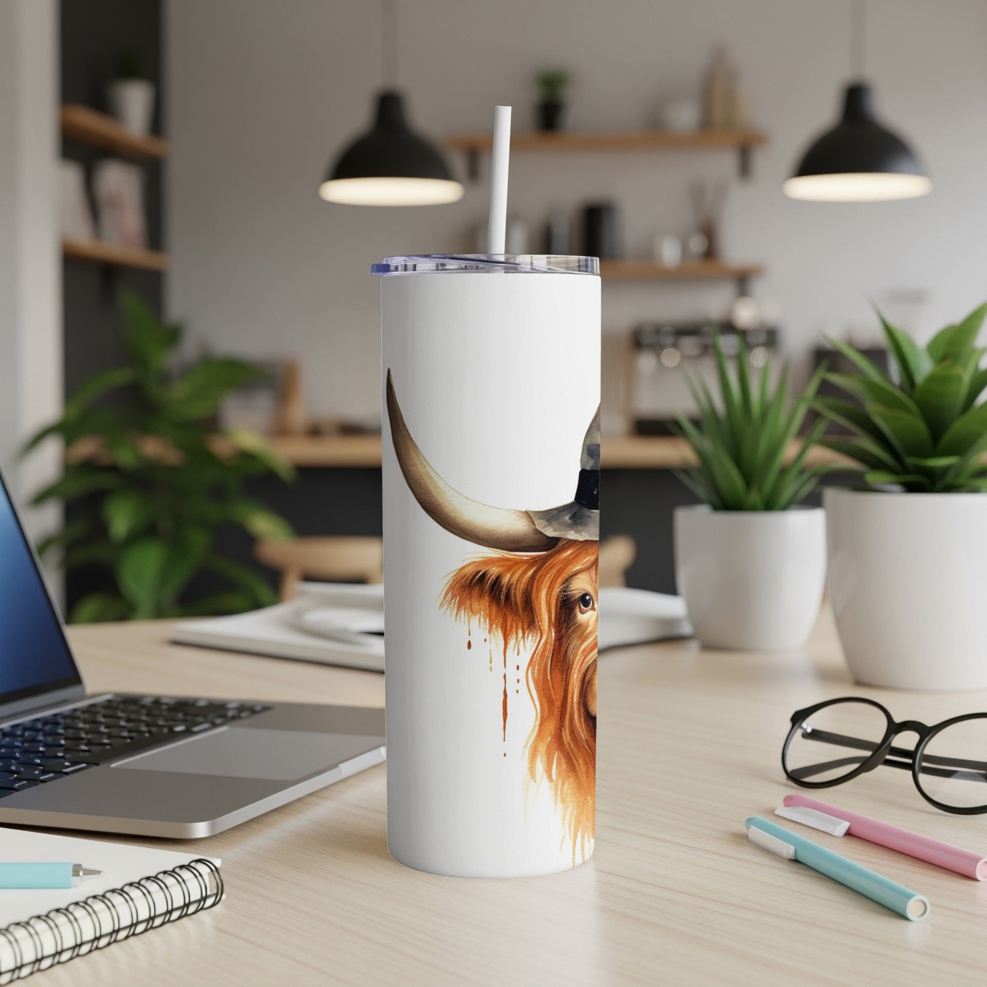 White tumbler with Highland cow wearing a witch hat and Halloween theme.