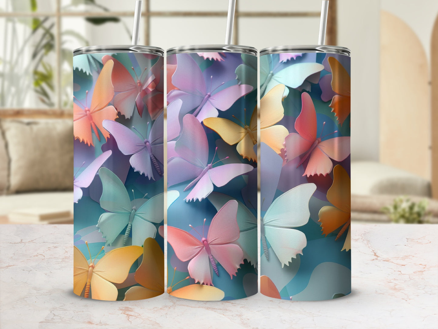 Three tumblers with pastel butterfly designs sit side-by-side.