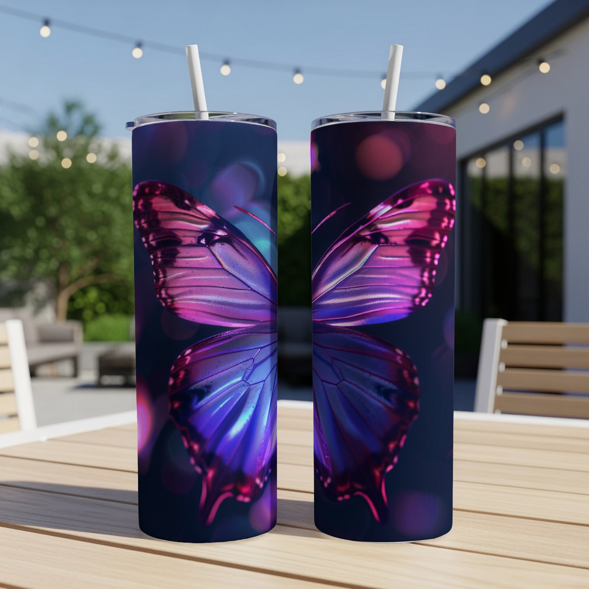 Two tumblers with iridescent butterfly wings, set on a wooden table.