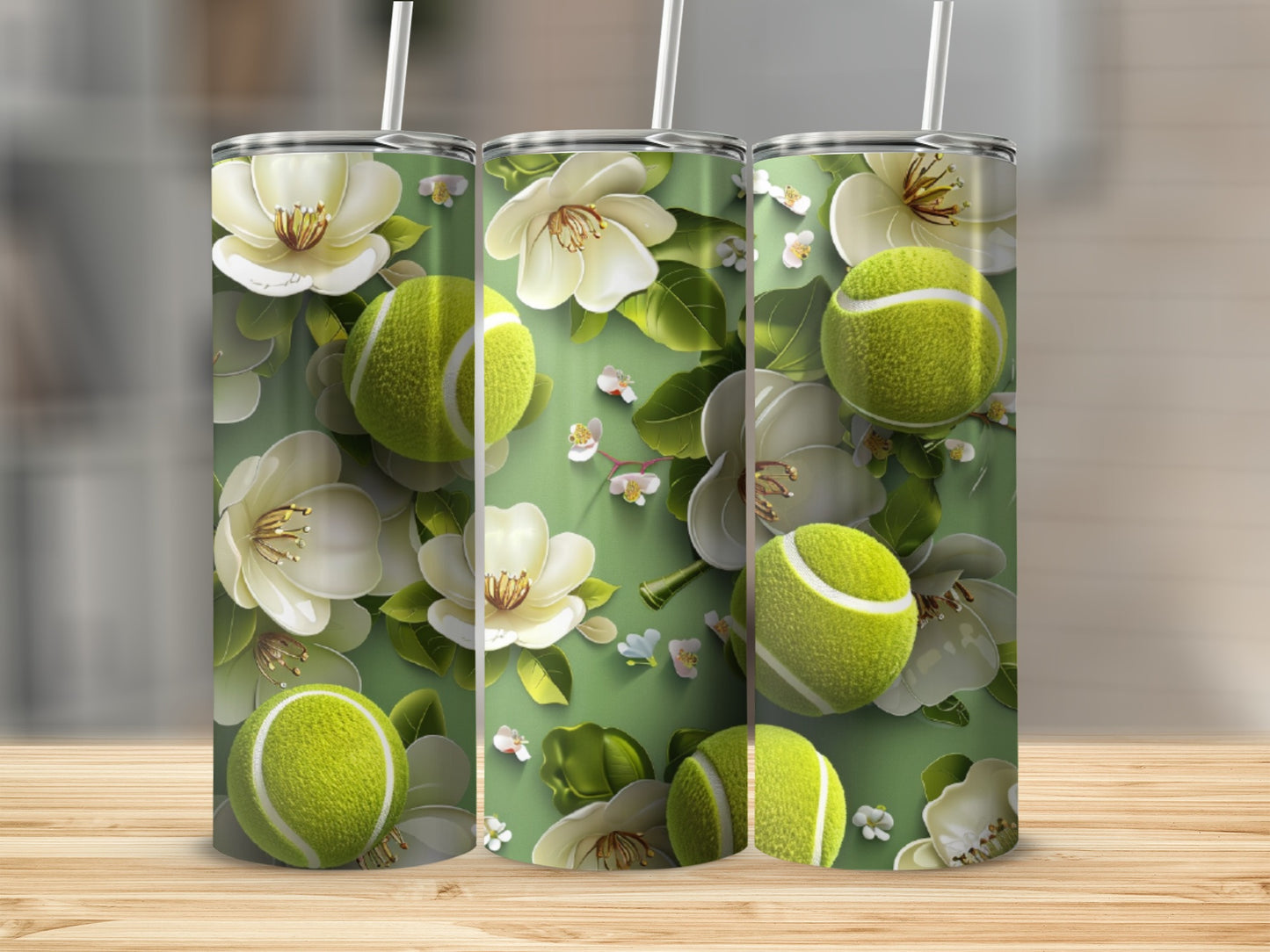 Tennis balls and magnolia flowers on a tall, cylindrical tumbler.