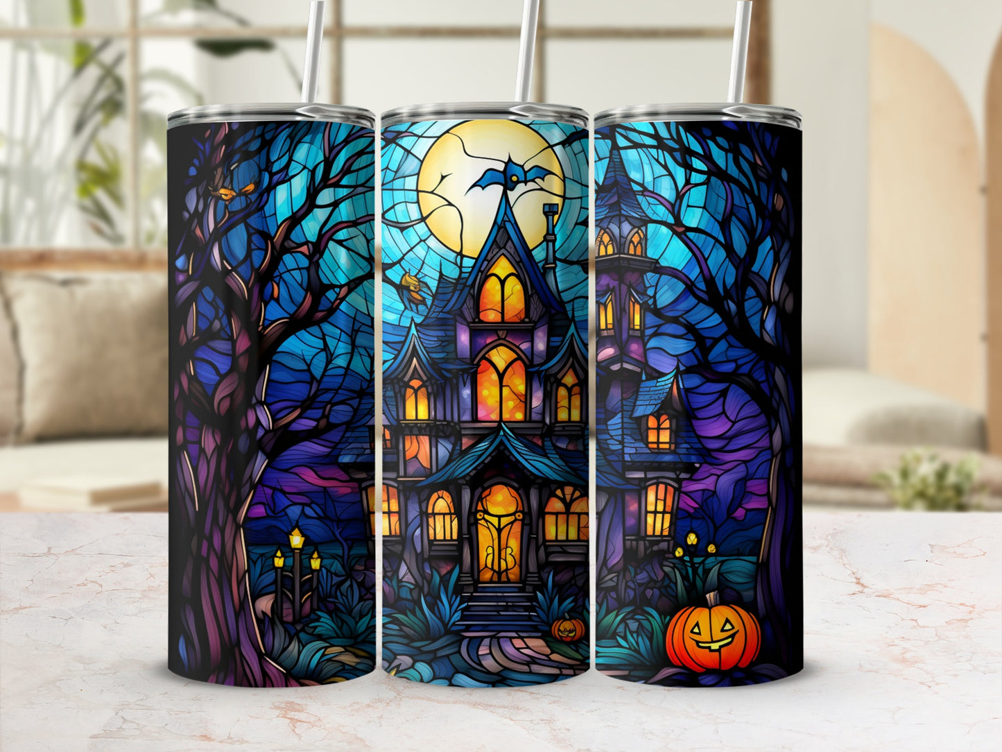 Halloween haunted house with moon and pumpkin design on a tumbler.