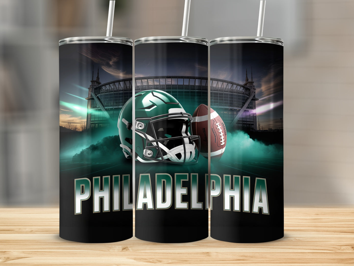 Tumbler with Philadelphia Eagles helmet, football, and stadium graphic.