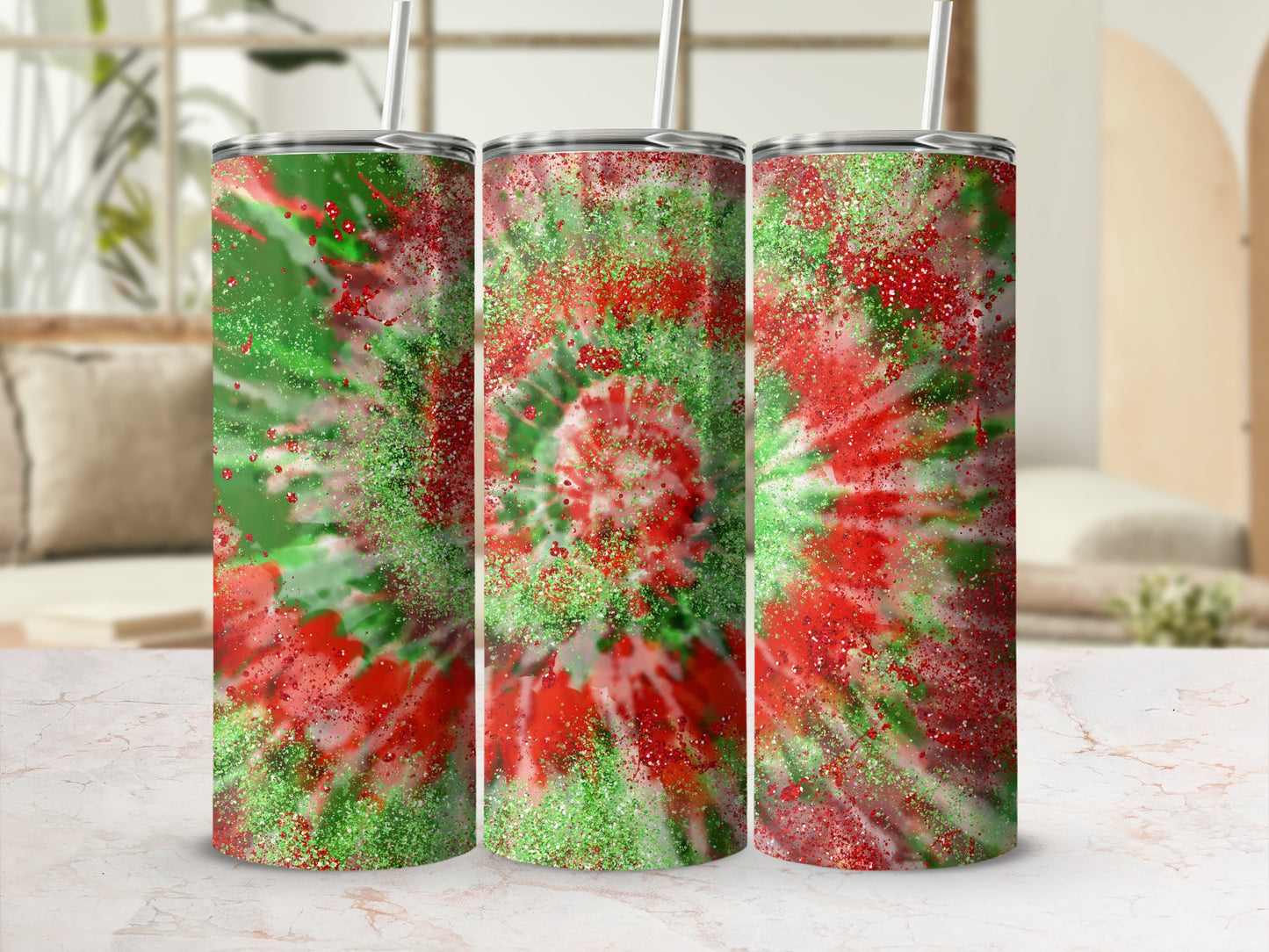 Red, green, and gold glitter tie-dye tumbler with straw.
