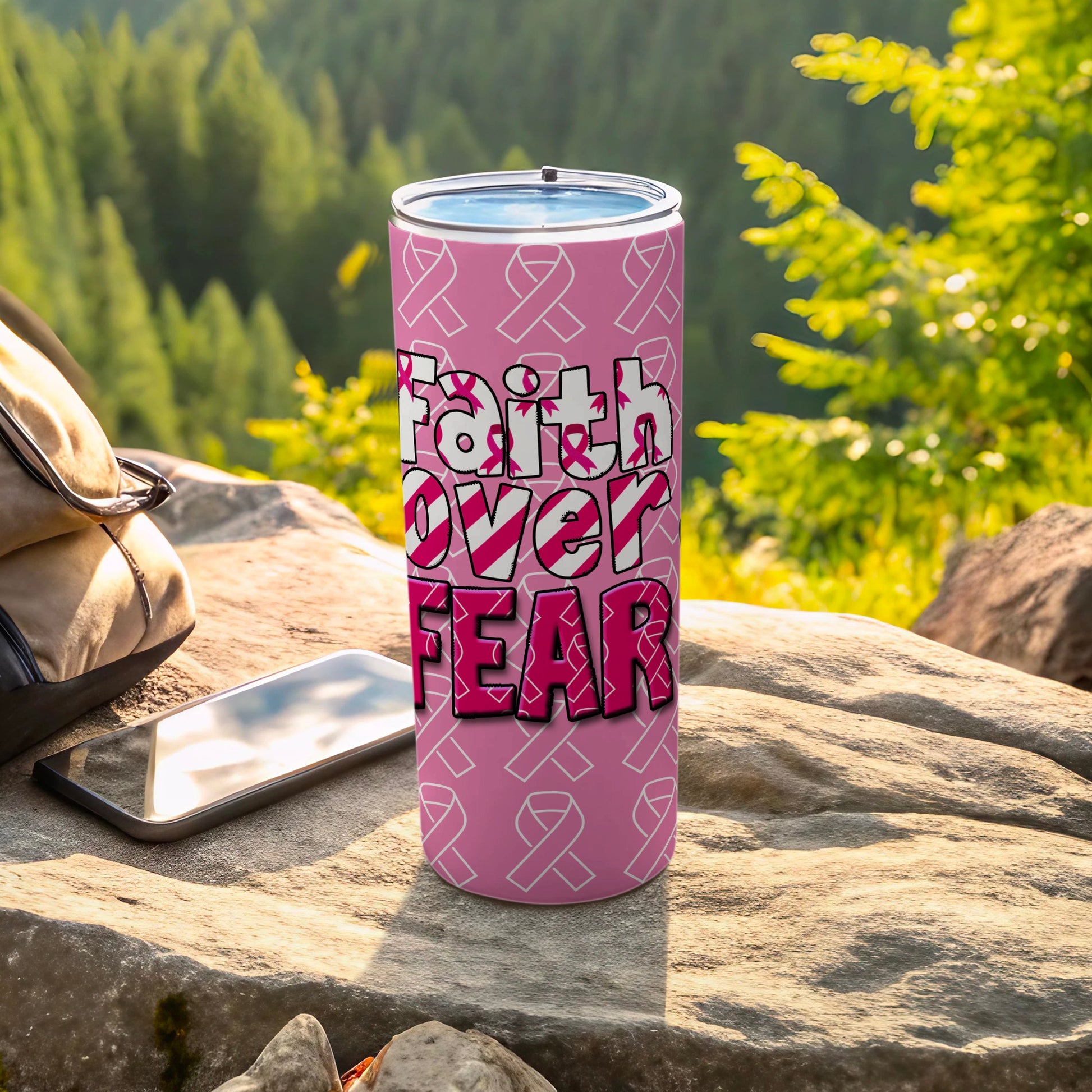Pink tumbler with "Faith Over Fear" and breast cancer ribbons.