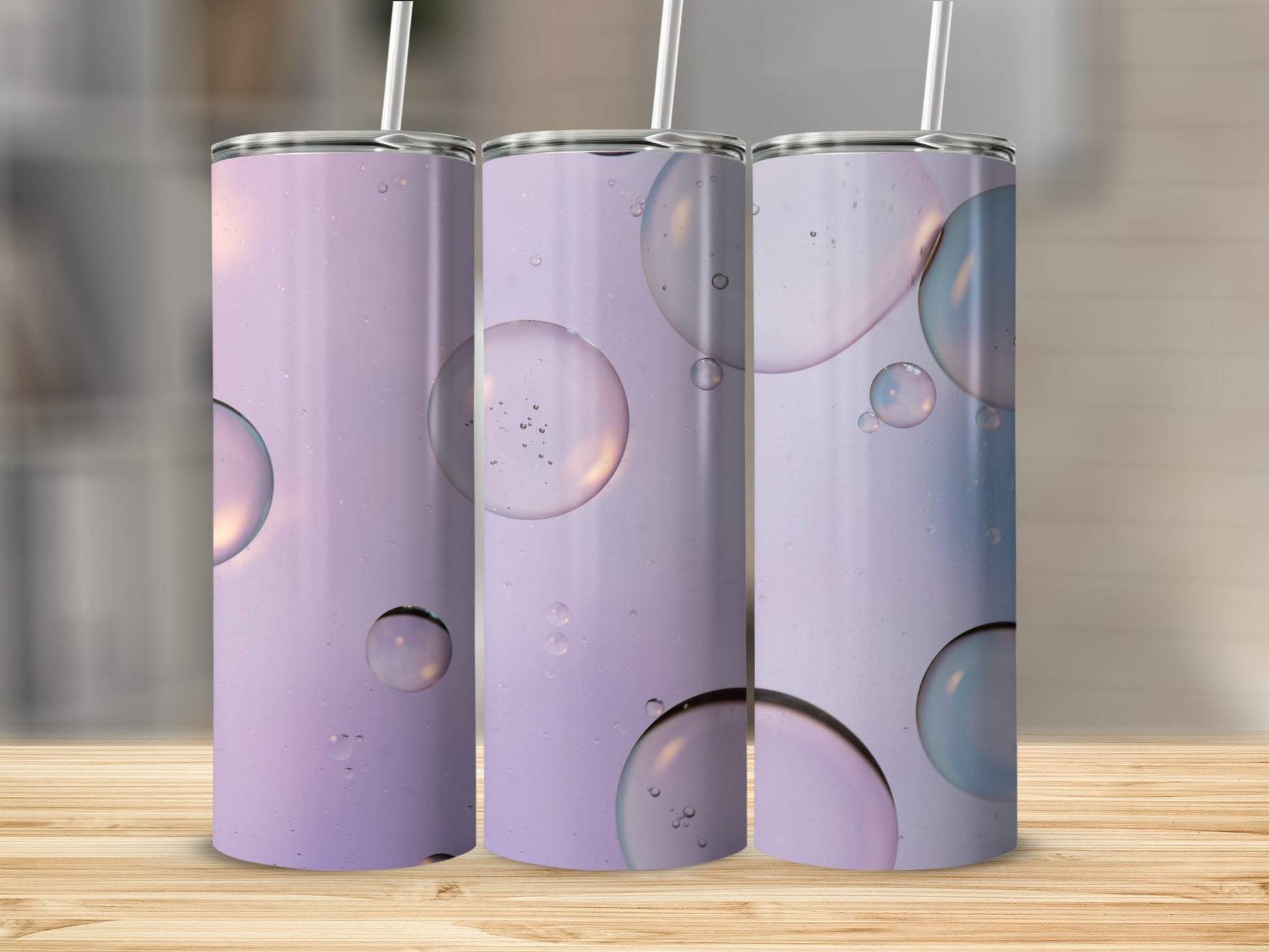 Triptych of tumblers with lavender and bubble pattern.