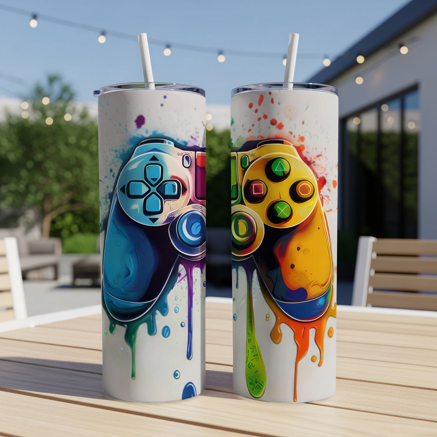 Two tumblers decorated with colorful, dripping video game controllers.