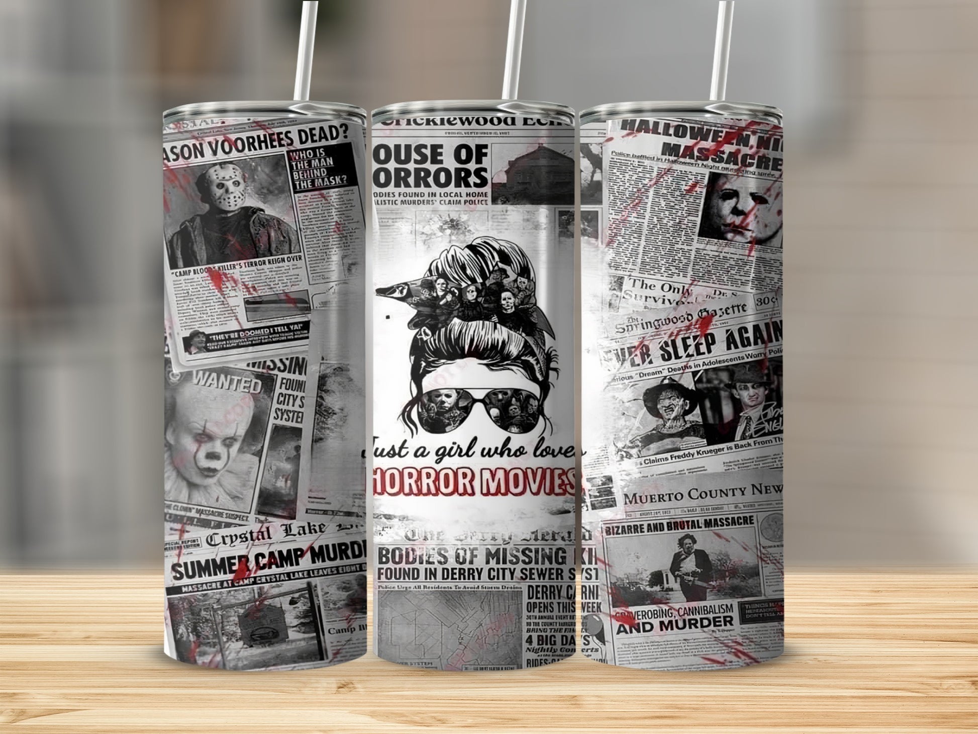 Tumbler with horror movie newspaper headlines and images, including Jason Voorhees and Pennywise.