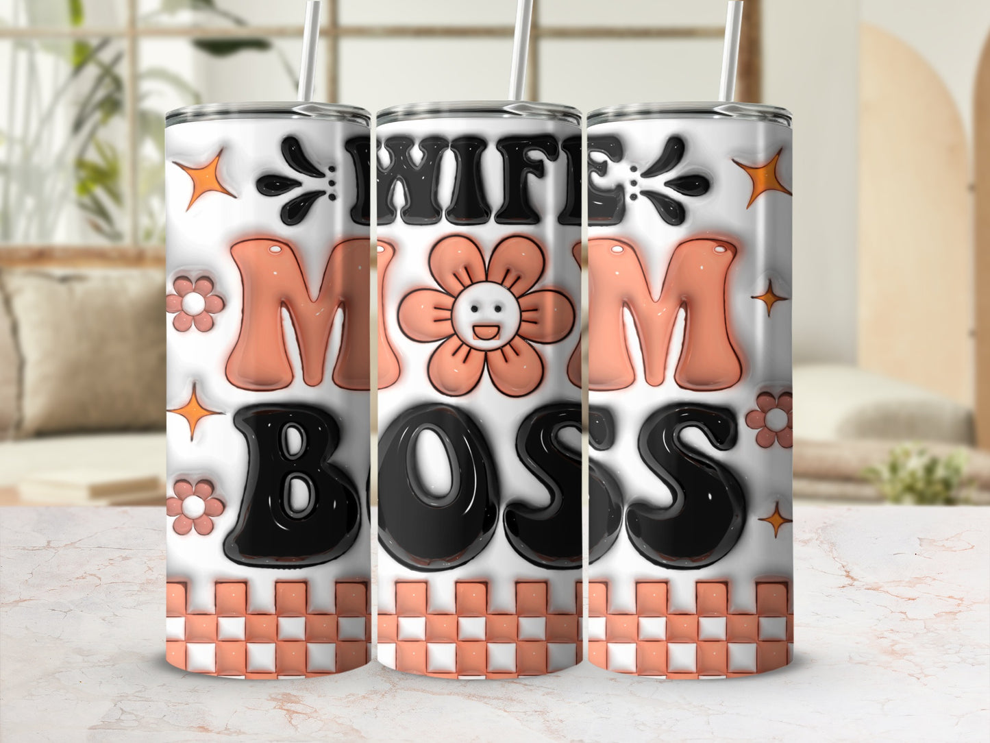 Tumbler with "Wife Mom Boss" text and floral accents.