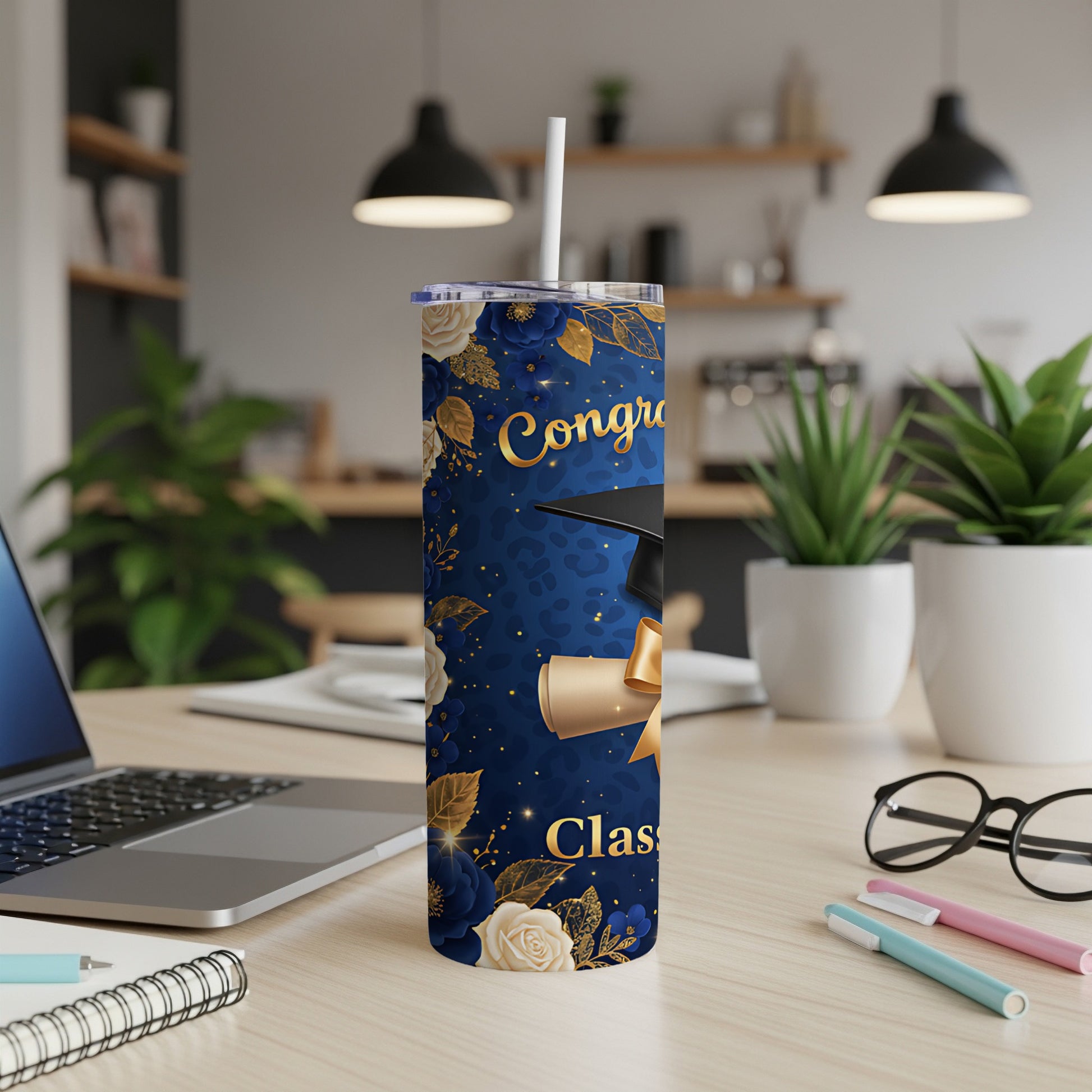 Graduation tumbler with diploma and floral design.