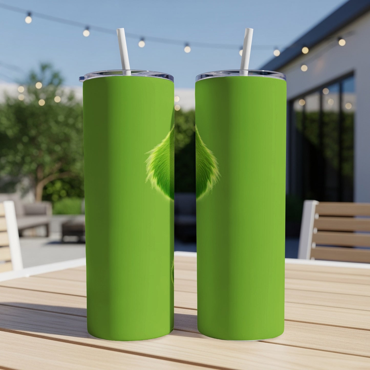 Two green tumblers with straw, featuring Grinch fur design.
