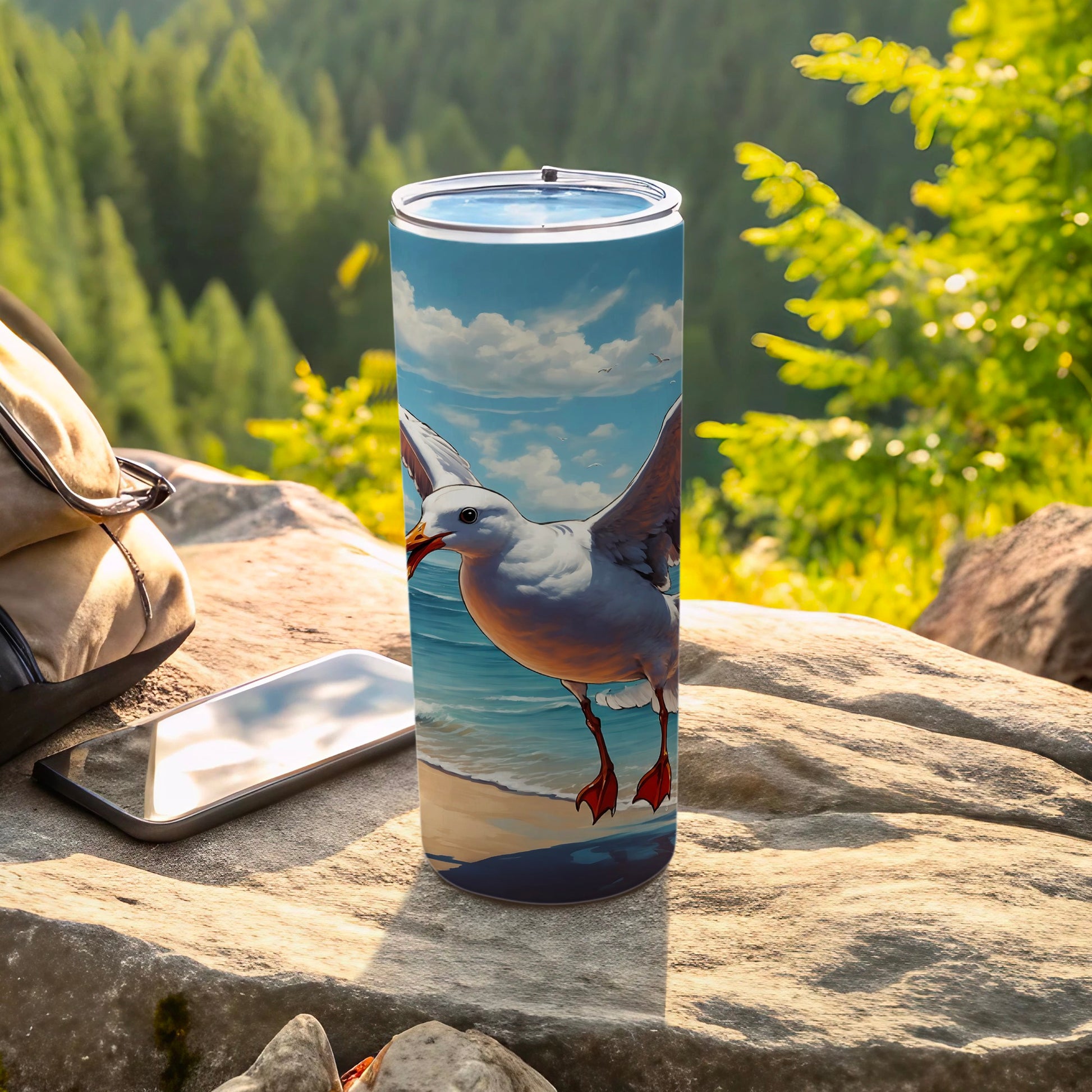 Seagull in flight over beach on a tall tumbler with backpack and phone.