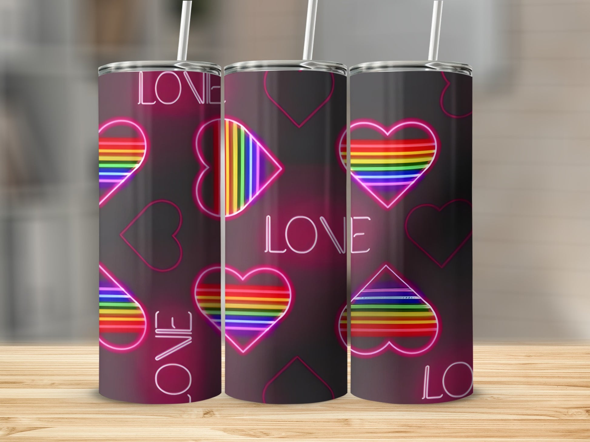 Three tumblers with rainbow heart and "LOVE" designs.