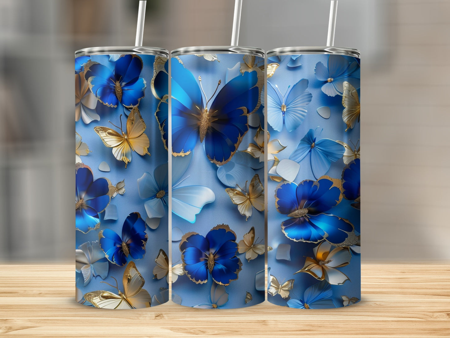 Blue tumbler with delicate gold and blue butterflies and flowers.