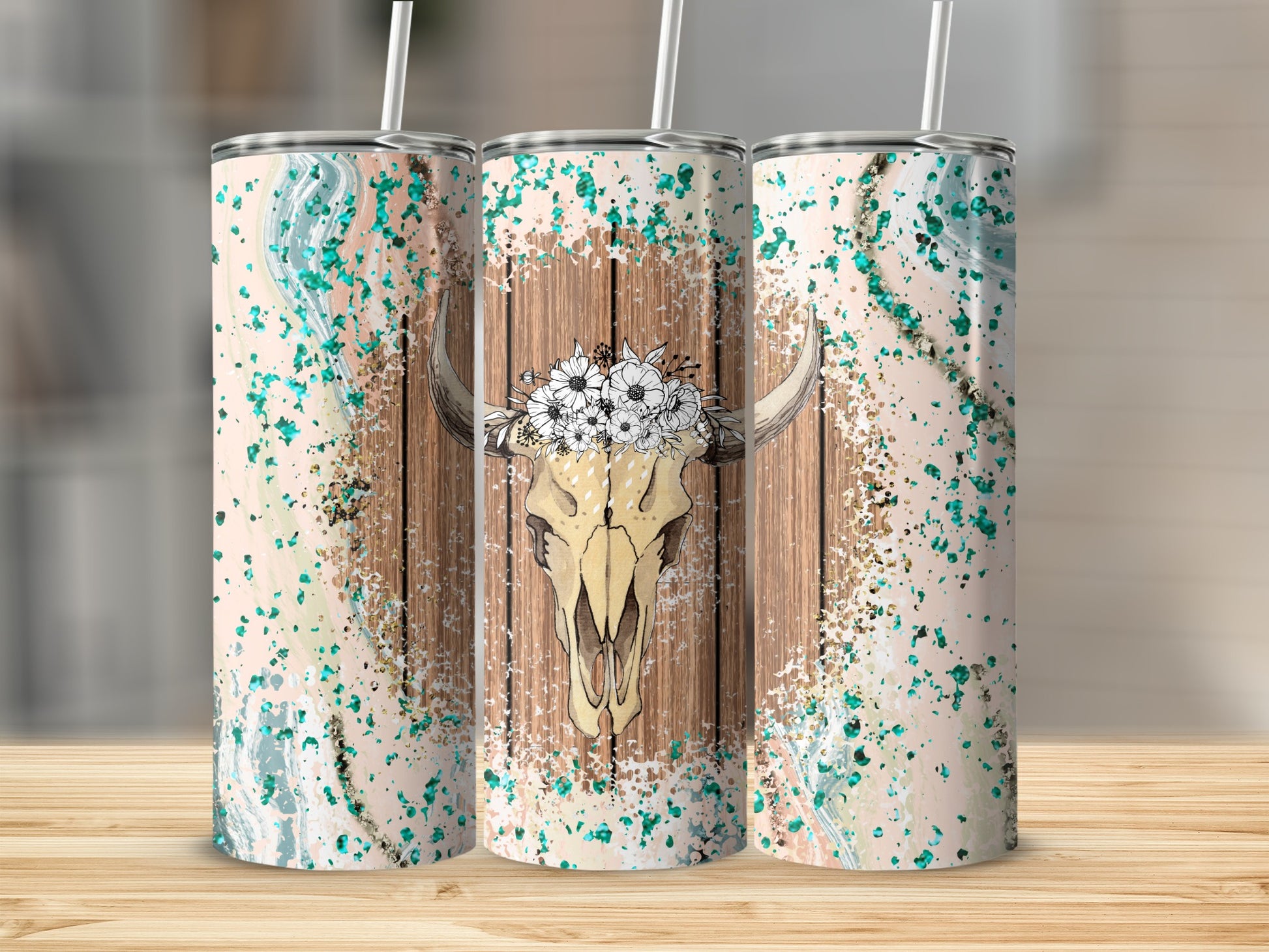 Three tumblers with bull skull and floral headpiece design.