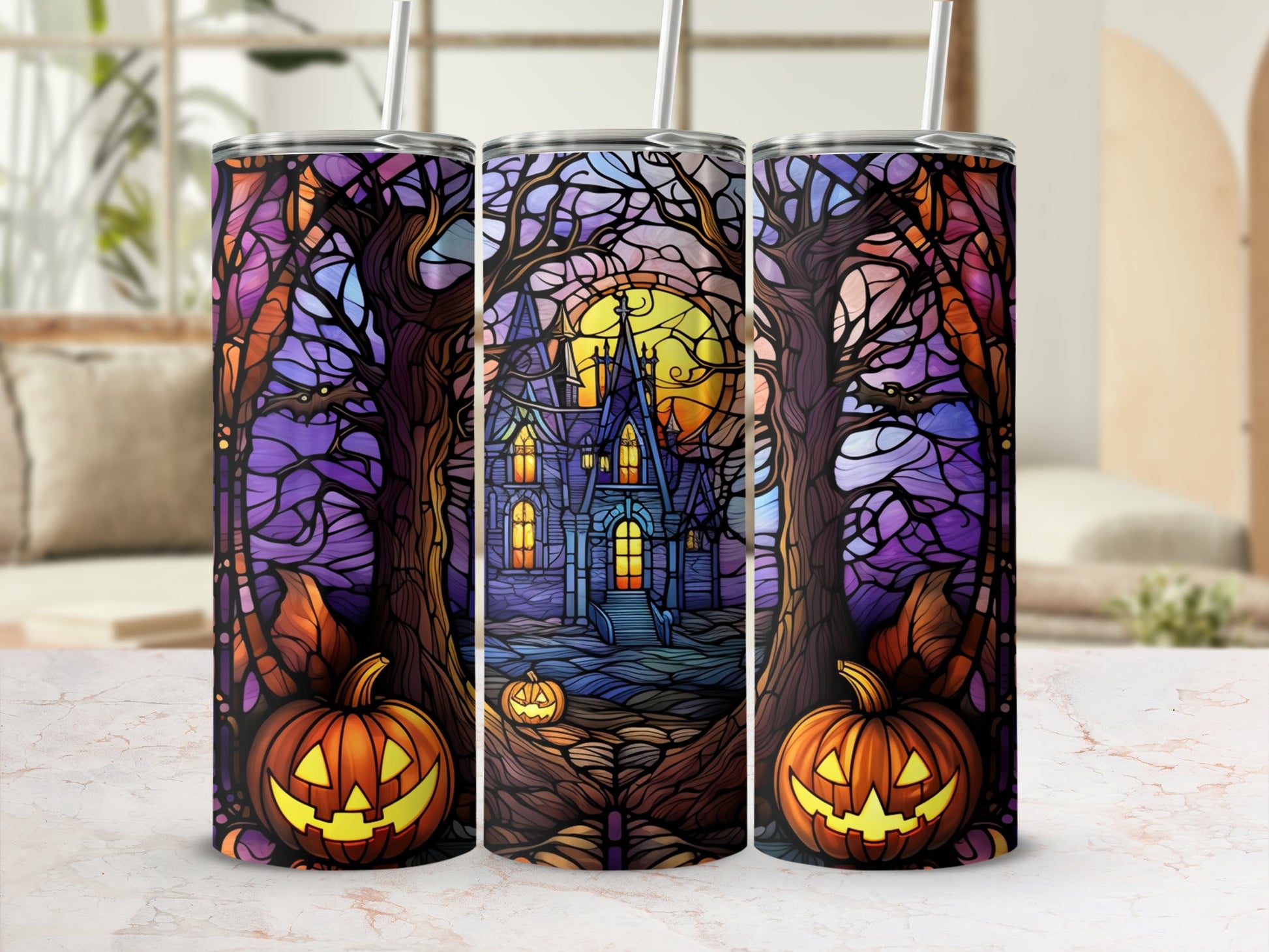 Halloween tumbler with spooky castle, pumpkins, and trees.
