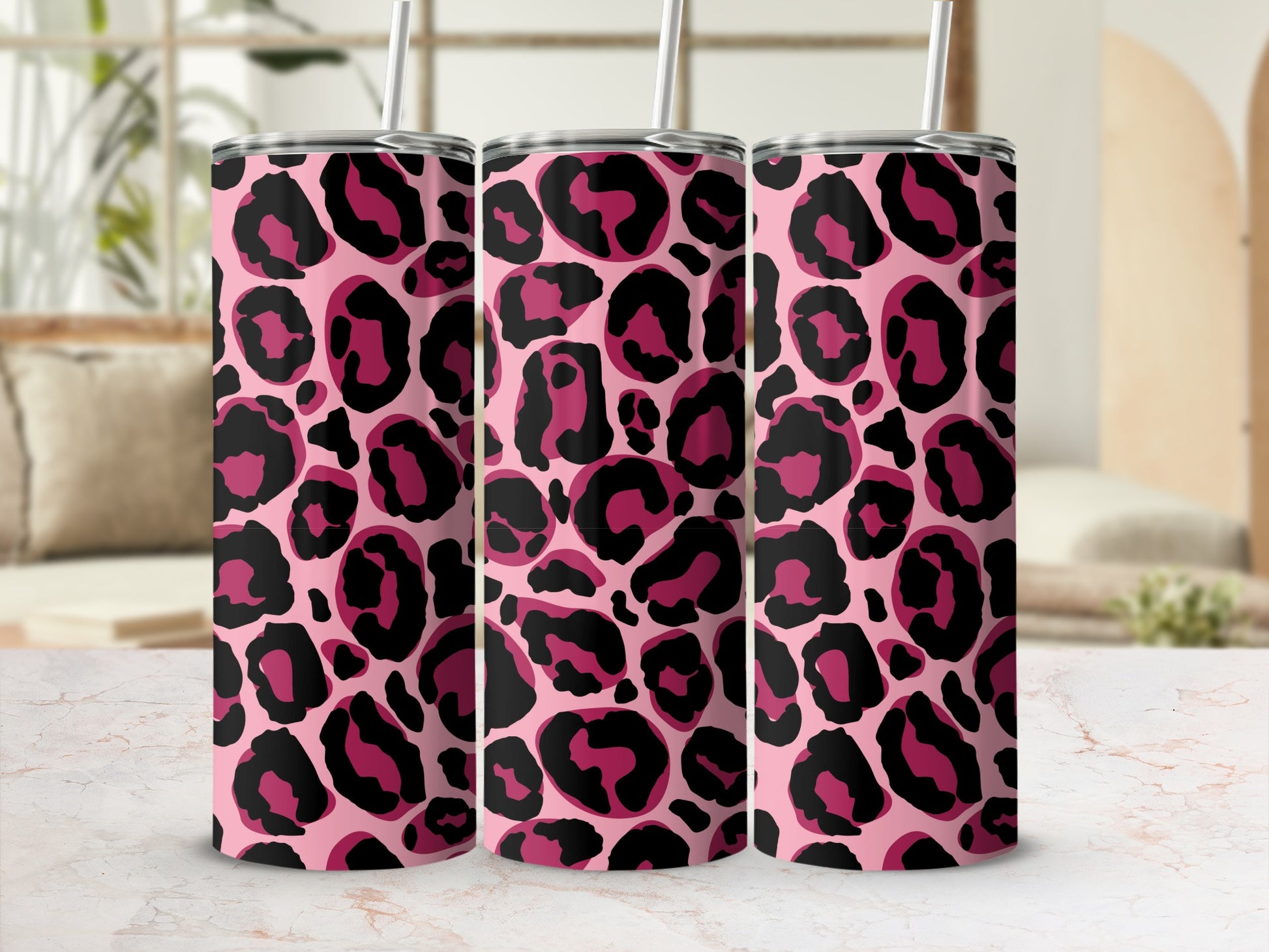Three pink tumblers with a black and hot pink leopard print pattern.