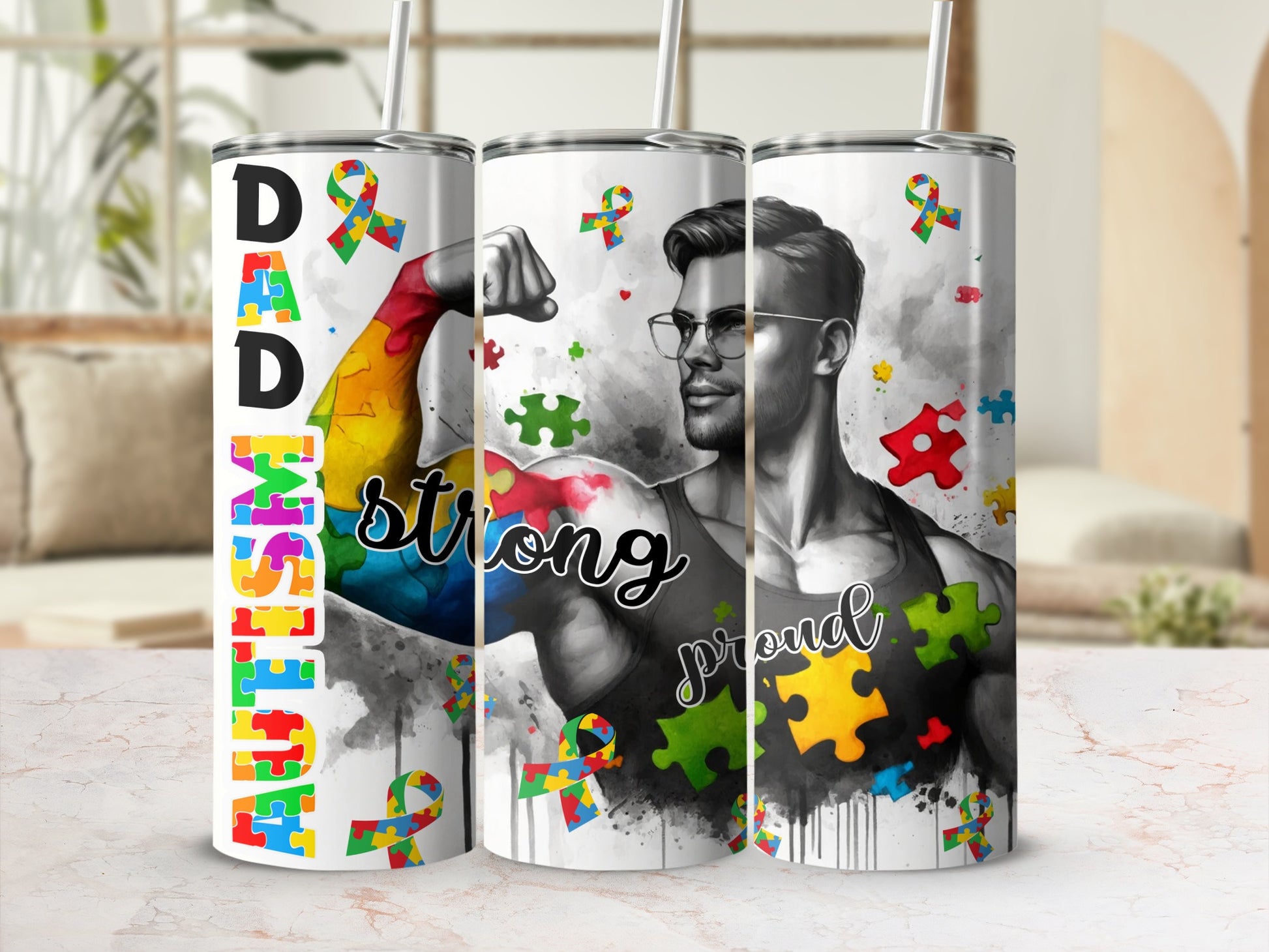 Three tumblers with autism awareness puzzles and "Dad Strong Proud" text.