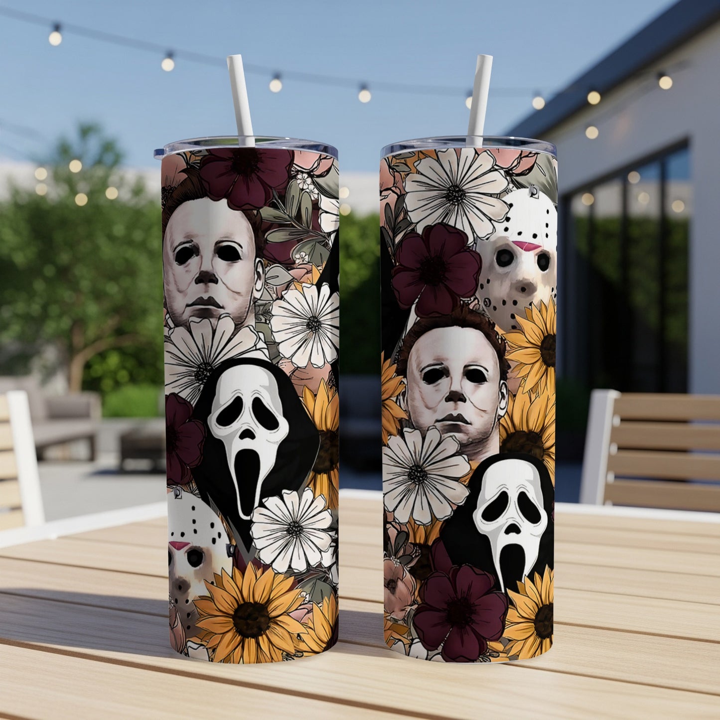 Two tumblers with horror movie characters and floral designs.