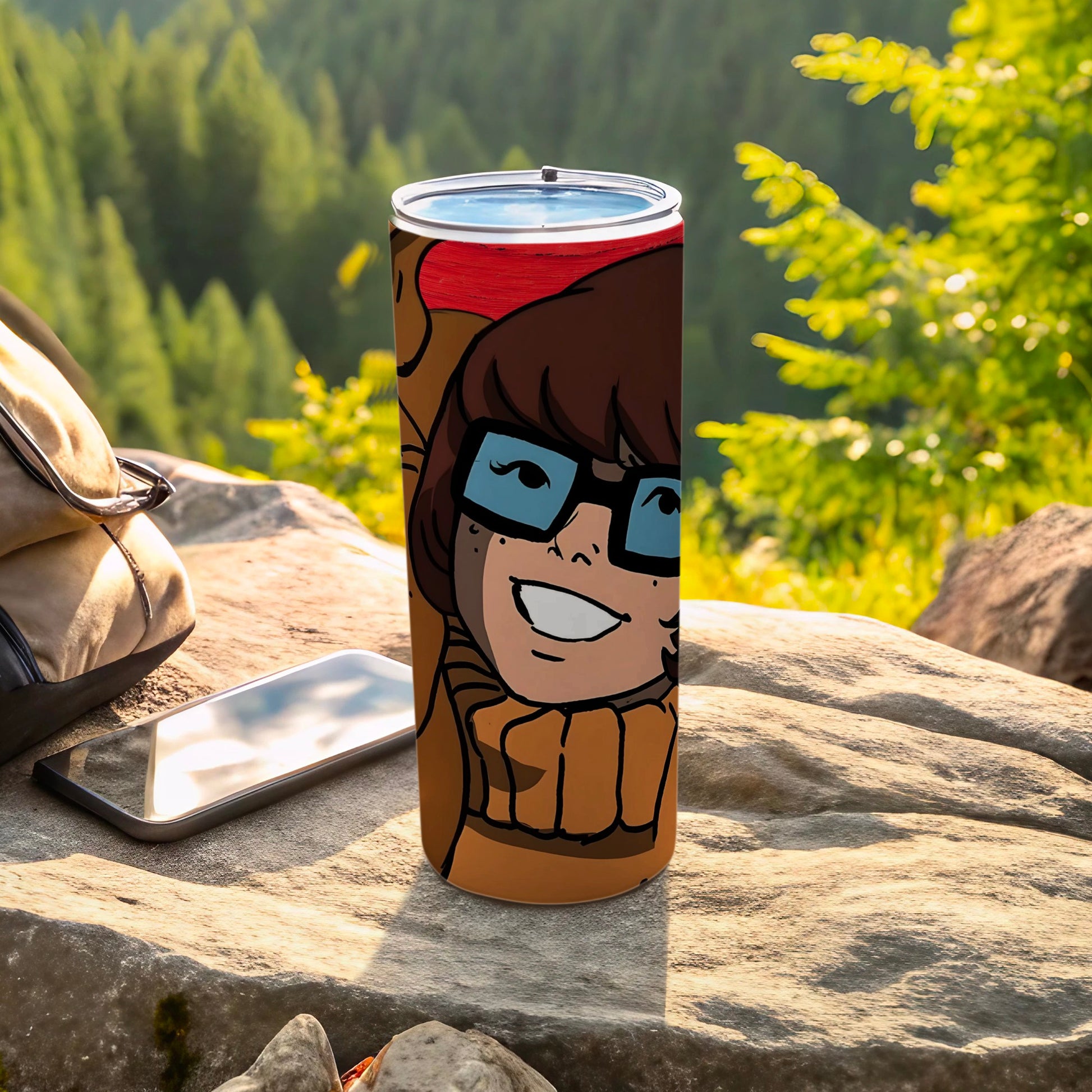 Scooby-Doo Velma character design on a brown tumbler with a backpack and phone.